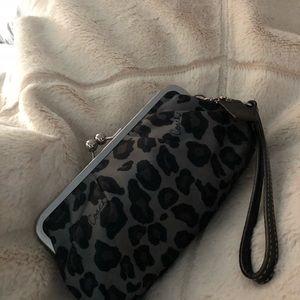 Small hand held clutch or wristlet leopard look